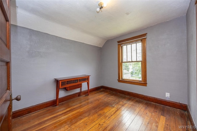 2215 S Ave, Niagara Falls, NY 14305 - additional living space with hardwood / wood-style floors, lofted ceiling, and baseboards