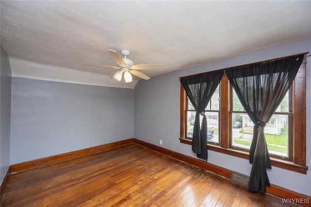 2215 S Ave, Niagara Falls, NY 14305 - spare room featuring baseboards, hardwood / wood-style floors, ceiling fan, and vaulted ceiling
