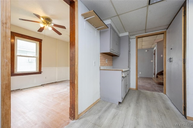 2215 S Ave, Niagara Falls, NY 14305 - kitchen featuring a drop ceiling, a ceiling fan, light wood finished floors, light countertops, and gray cabinets