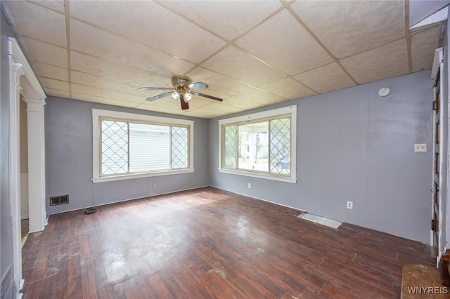 2215 S Ave, Niagara Falls, NY 14305 - unfurnished room featuring ceiling fan, wood-type flooring, a drop ceiling, decorative columns, and a smoke detector
