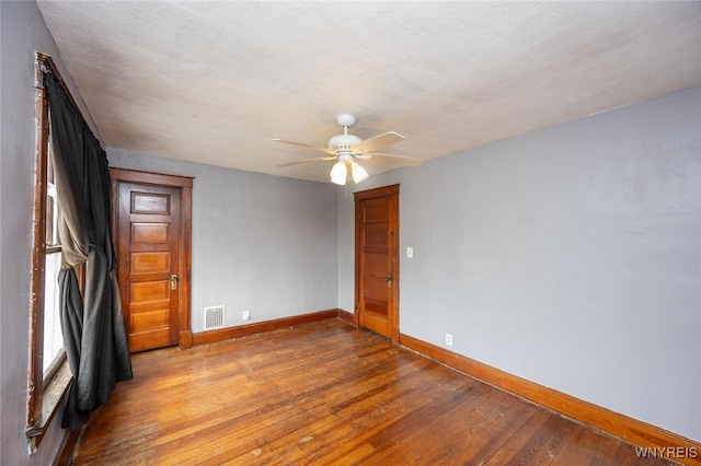 2215 S Ave, Niagara Falls, NY 14305 - empty room featuring baseboards, wood-type flooring, and ceiling fan