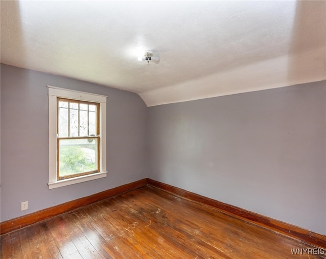 2215 S Ave, Niagara Falls, NY 14305 - bonus room featuring baseboards, lofted ceiling, and wood-type flooring