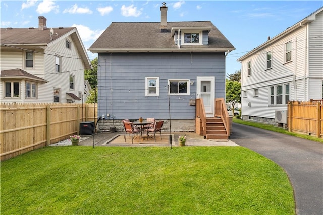 24 Spencer Rd, Irondequoit, NY 14609 - back of property with roof with shingles, a patio, entry steps, a chimney, and ac unit