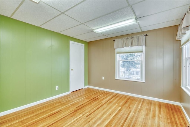 1845 N Clinton Ave, Rochester, NY 14621 - empty room with wood finished floors, baseboards, and a paneled ceiling
