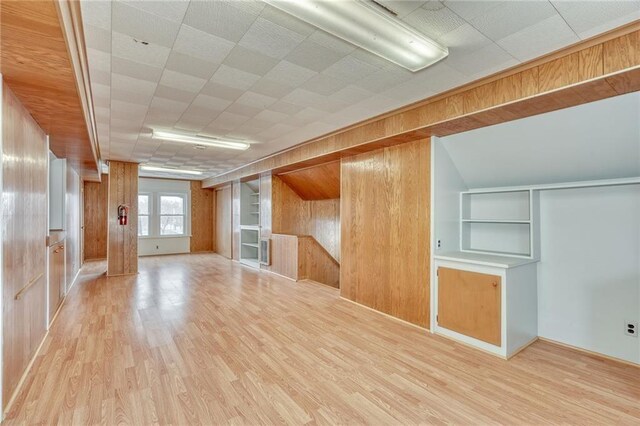 1845 N Clinton Ave, Rochester, NY 14621 - additional living space featuring wooden walls, wood finished floors, and built in features