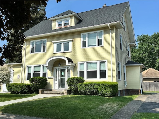 1845 N Clinton Ave, Rochester, NY 14621 - view of front of home with a front yard, entry steps, and roof with shingles