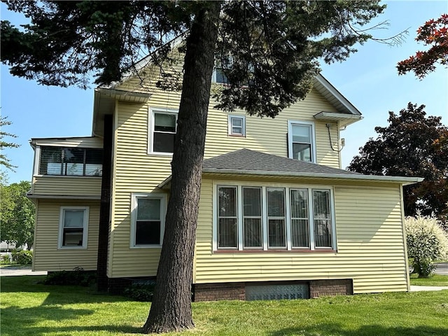 1845 N Clinton Ave, Rochester, NY 14621 - rear view of property featuring a lawn
