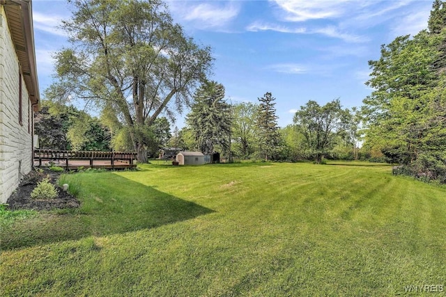 100 Brompton Rd, Amherst, NY 14221 - view of green lawn featuring a wooden deck