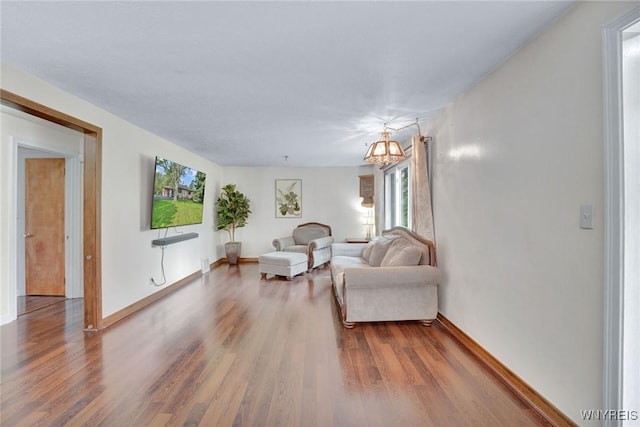 100 Brompton Rd, Amherst, NY 14221 - living area featuring wood finished floors, baseboards, and a chandelier
