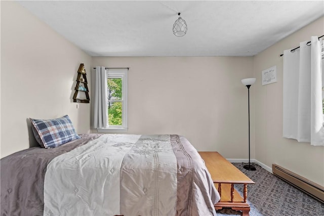 7425 State Route 20a, Bristol, NY 14469 - carpeted bedroom with a baseboard heating unit and baseboards