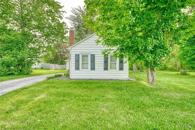 4356 Redman Rd, Sweden, NY 14420 - view of home's exterior featuring a chimney and asphalt driveway