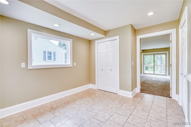 4356 Redman Rd, Sweden, NY 14420 - unfurnished bedroom with recessed lighting, a closet, and light tile patterned flooring