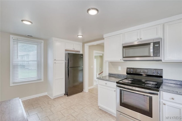 4356 Redman Rd, Sweden, NY 14420 - kitchen with appliances with stainless steel finishes, white cabinetry, and light tile patterned floors