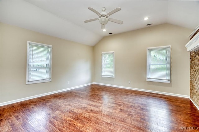 4356 Redman Rd, Sweden, NY 14420 - empty room with healthy amount of natural light, vaulted ceiling, a ceiling fan, and a brick fireplace