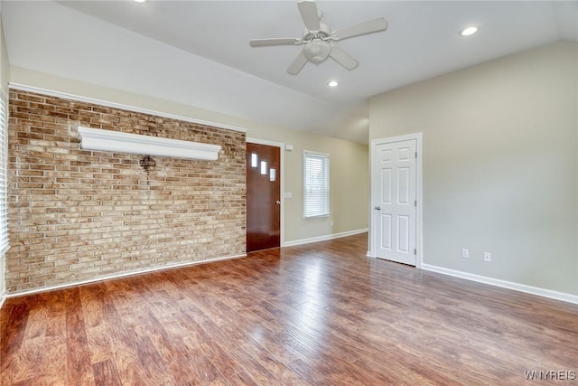 4356 Redman Rd, Sweden, NY 14420 - unfurnished living room with vaulted ceiling, brick wall, ceiling fan, wood finished floors, and recessed lighting