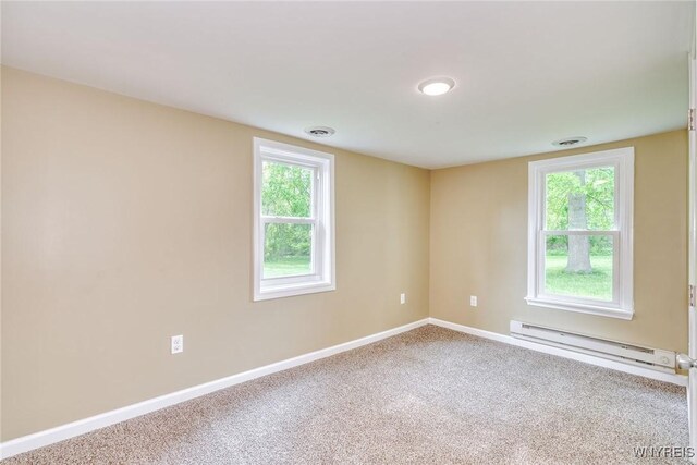 4356 Redman Rd, Sweden, NY 14420 - carpeted empty room with a baseboard heating unit and plenty of natural light