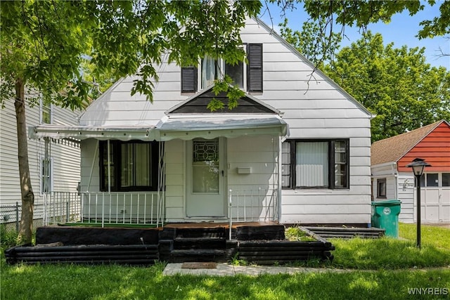 1934 Welch Ave, Niagara Falls, NY 14303 - view of front of home featuring covered porch and a garage