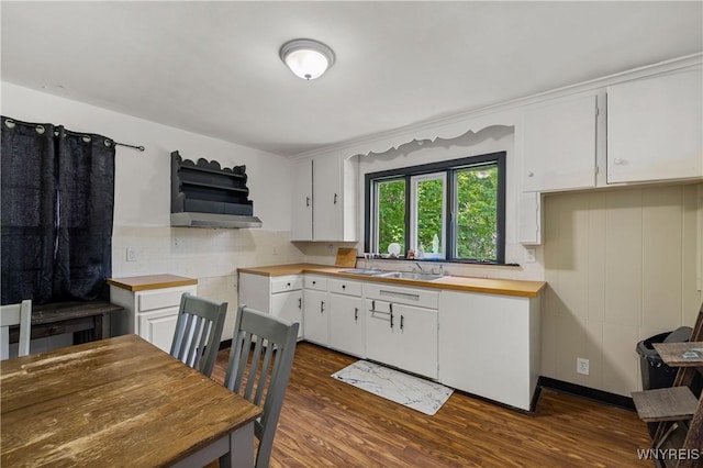 1934 Welch Ave, Niagara Falls, NY 14303 - kitchen featuring dark wood-style flooring, backsplash, white cabinets, and wood counters