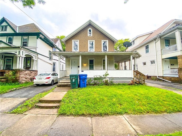 127 Ave B, Rochester, NY 14621 - view of front of house with covered porch and a front yard