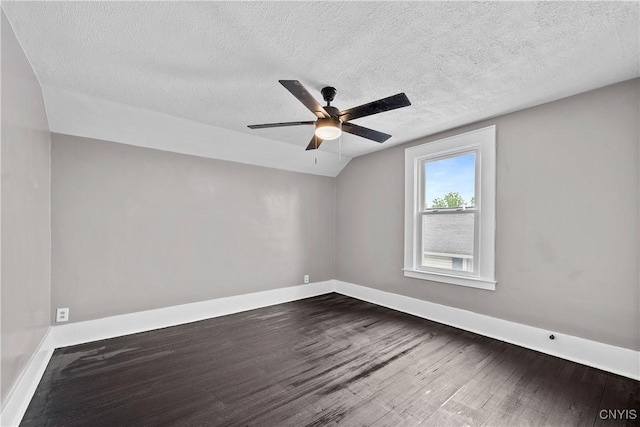 402 Cogswell Ave, Geddes, NY 13209 - spare room featuring dark wood-type flooring, lofted ceiling, baseboards, a textured ceiling, and a ceiling fan