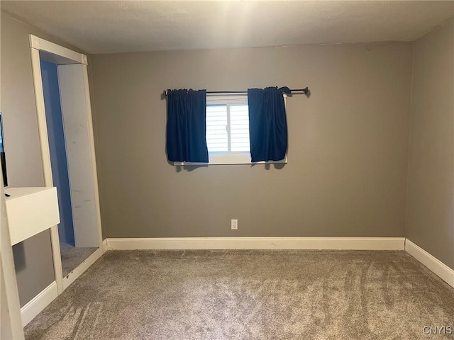 207 E Elm St, Oneida-Inside, NY 13421 - spare room featuring carpet floors and baseboards