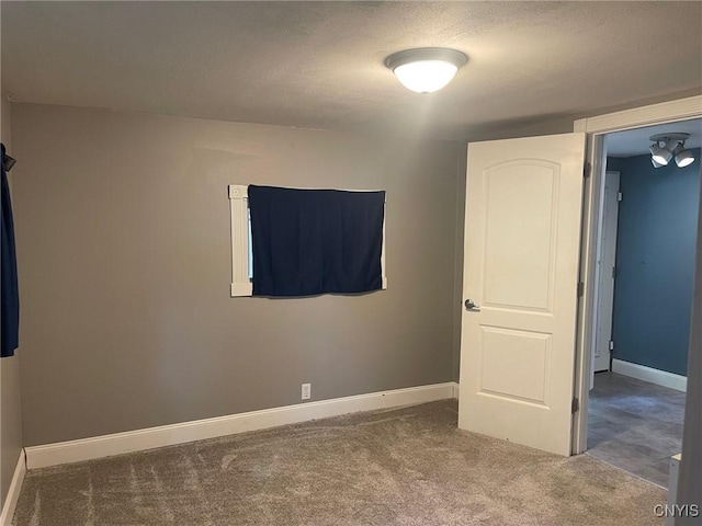 207 E Elm St, Oneida-Inside, NY 13421 - unfurnished bedroom with carpet flooring, baseboards, and a textured ceiling