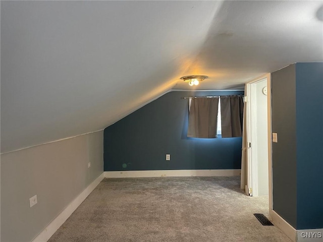 207 E Elm St, Oneida-Inside, NY 13421 - additional living space with carpet, lofted ceiling, and baseboards
