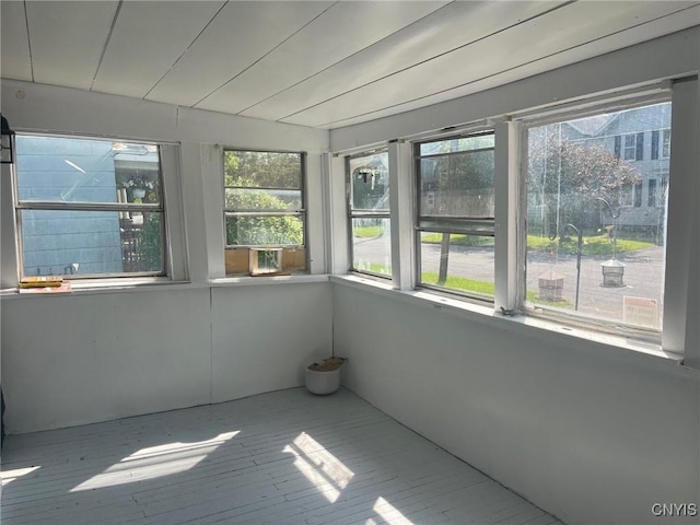 207 E Elm St, Oneida-Inside, NY 13421 - unfurnished sunroom featuring a wooden deck and wood finished floors