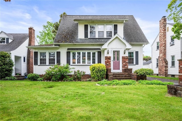 377 Winfield Rd, Irondequoit, NY 14622 - view of front of home with entry steps, a front lawn, and roof with shingles