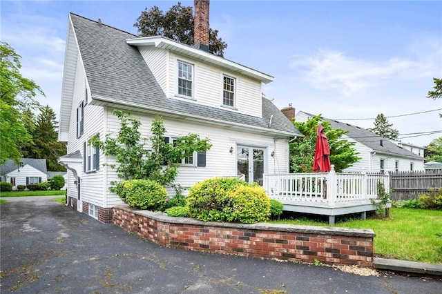 377 Winfield Rd, Irondequoit, NY 14622 - back of house with a chimney, a deck, and roof with shingles