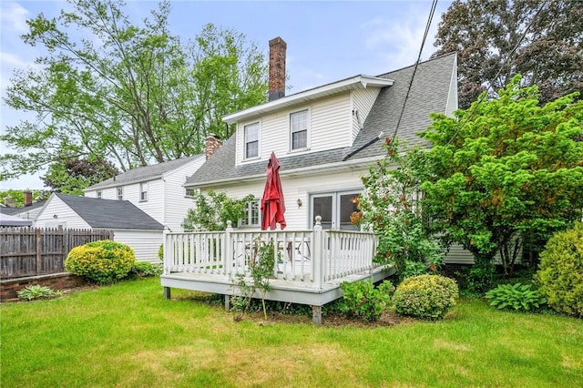 377 Winfield Rd, Irondequoit, NY 14622 - back of property featuring a wooden deck, a chimney, and a shingled roof