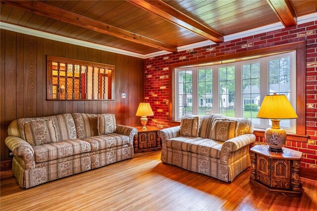 377 Winfield Rd, Irondequoit, NY 14622 - living area with wood finished floors, brick wall, wood walls, and wood ceiling with exposed beams