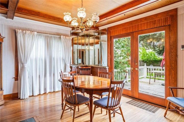 377 Winfield Rd, Irondequoit, NY 14622 - dining area featuring wood finished floors, a chandelier, wood ceiling with exposed beams, and french doors
