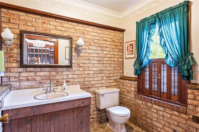 377 Winfield Rd, Irondequoit, NY 14622 - half bathroom featuring vanity, toilet, and ornamental molding