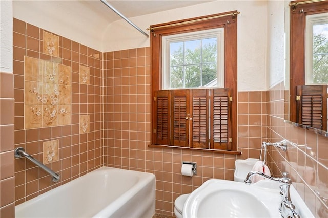 377 Winfield Rd, Irondequoit, NY 14622 - bathroom with tile walls, a tub, a sink, and toilet