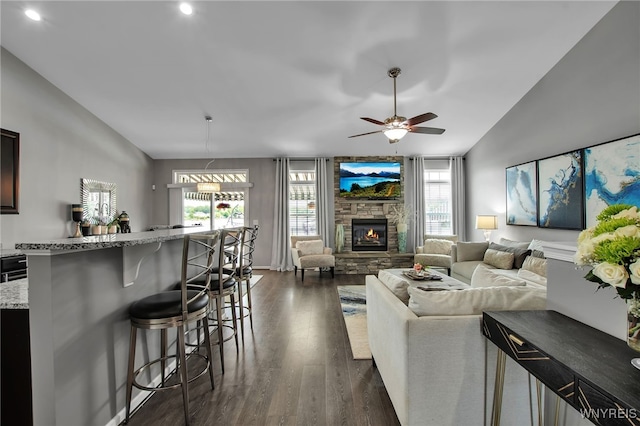 27 Skylark Ln, Wheatfield, NY 14304 - living area with lofted ceiling, dark wood-style flooring, a ceiling fan, a fireplace, and recessed lighting