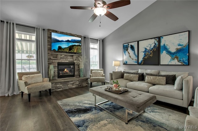 27 Skylark Ln, Wheatfield, NY 14304 - living area with wood finished floors, vaulted ceiling, a ceiling fan, plenty of natural light, and a fireplace