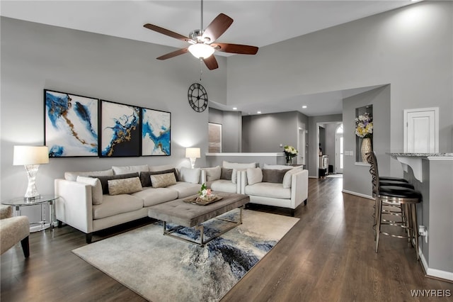 27 Skylark Ln, Wheatfield, NY 14304 - living area with high vaulted ceiling, ceiling fan, dark wood finished floors, and baseboards