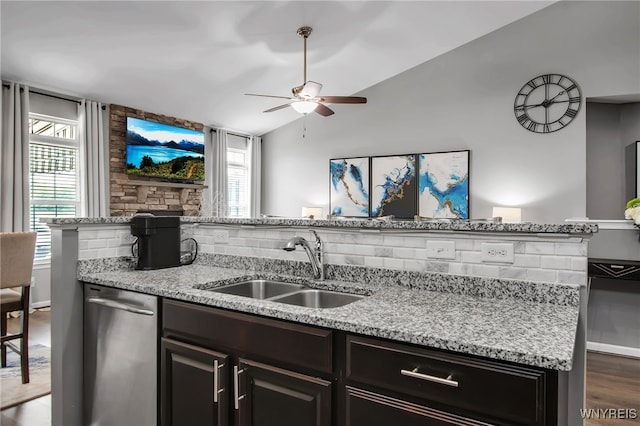 27 Skylark Ln, Wheatfield, NY 14304 - kitchen featuring a sink, dishwasher, ceiling fan, vaulted ceiling, and light stone counters