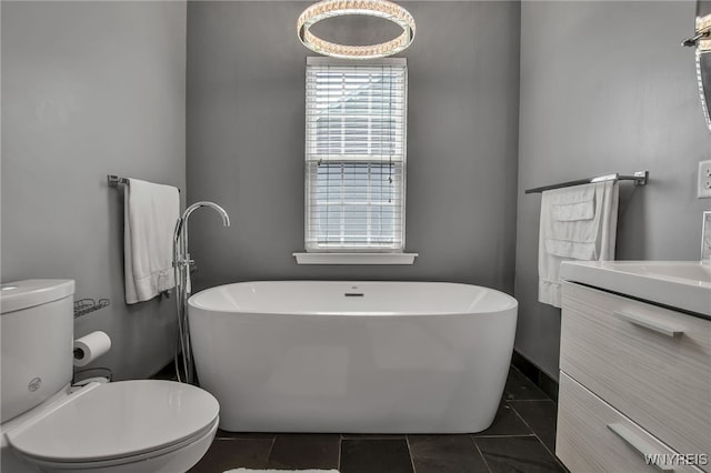 27 Skylark Ln, Wheatfield, NY 14304 - bathroom featuring vanity, a freestanding bath, and toilet