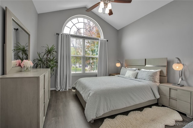 27 Skylark Ln, Wheatfield, NY 14304 - bedroom with dark wood-style flooring, multiple windows, vaulted ceiling, ceiling fan, and baseboards