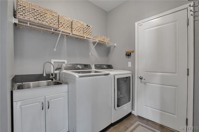 27 Skylark Ln, Wheatfield, NY 14304 - laundry room featuring washing machine and clothes dryer, cabinet space, and dark wood finished floors