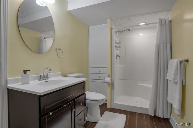 27 Skylark Ln, Wheatfield, NY 14304 - bathroom featuring wood finished floors, vanity, curtained shower, and toilet