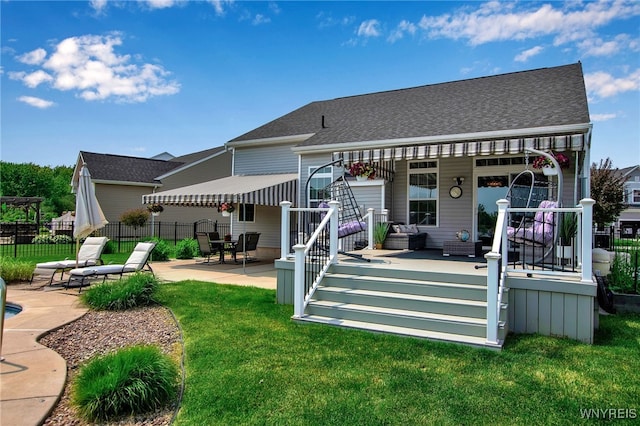 27 Skylark Ln, Wheatfield, NY 14304 - back of house featuring a patio and a shingled roof