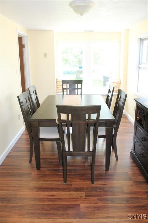 42 Mechanic St, Elbridge, NY 13080 - dining area with wood finished floors and baseboards