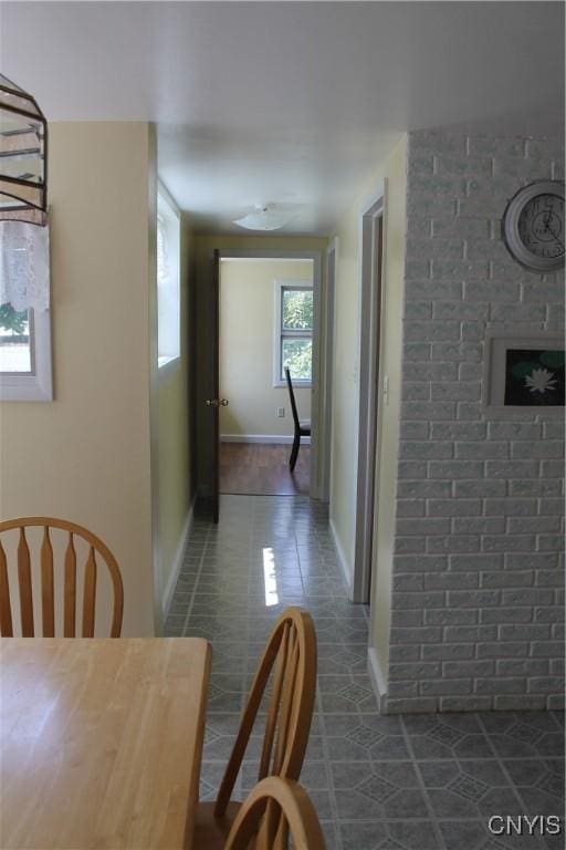 42 Mechanic St, Elbridge, NY 13080 - hall with dark tile patterned floors and baseboards