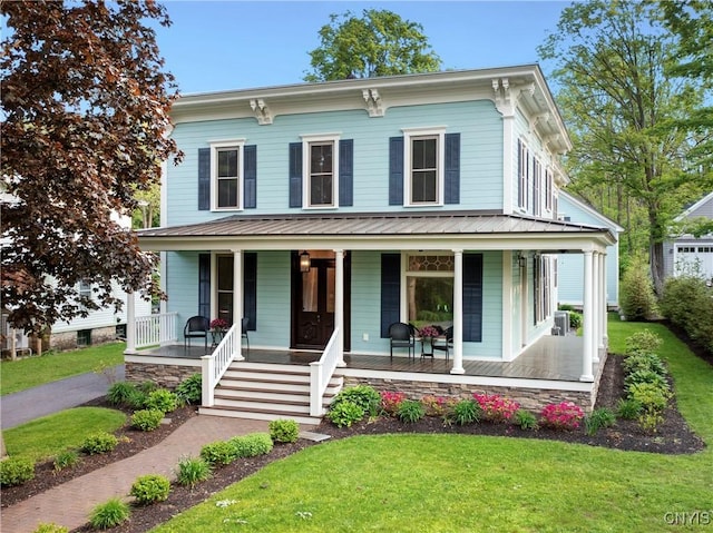 149 E Genesee St, Skaneateles, NY 13152 - italianate home with covered porch, a front yard, and metal roof