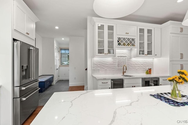 149 E Genesee St, Skaneateles, NY 13152 - kitchen featuring high end fridge, a sink, white cabinets, beverage cooler, and recessed lighting