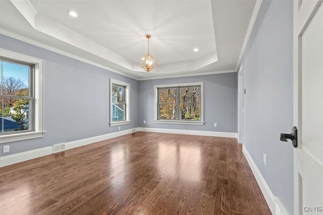 149 E Genesee St, Skaneateles, NY 13152 - unfurnished room featuring healthy amount of natural light, a raised ceiling, wood finished floors, crown molding, and recessed lighting