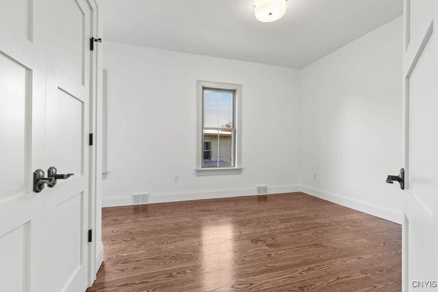 149 E Genesee St, Skaneateles, NY 13152 - unfurnished room featuring wood finished floors and baseboards